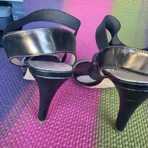 Designer black and silver leather high heels with ankle strap